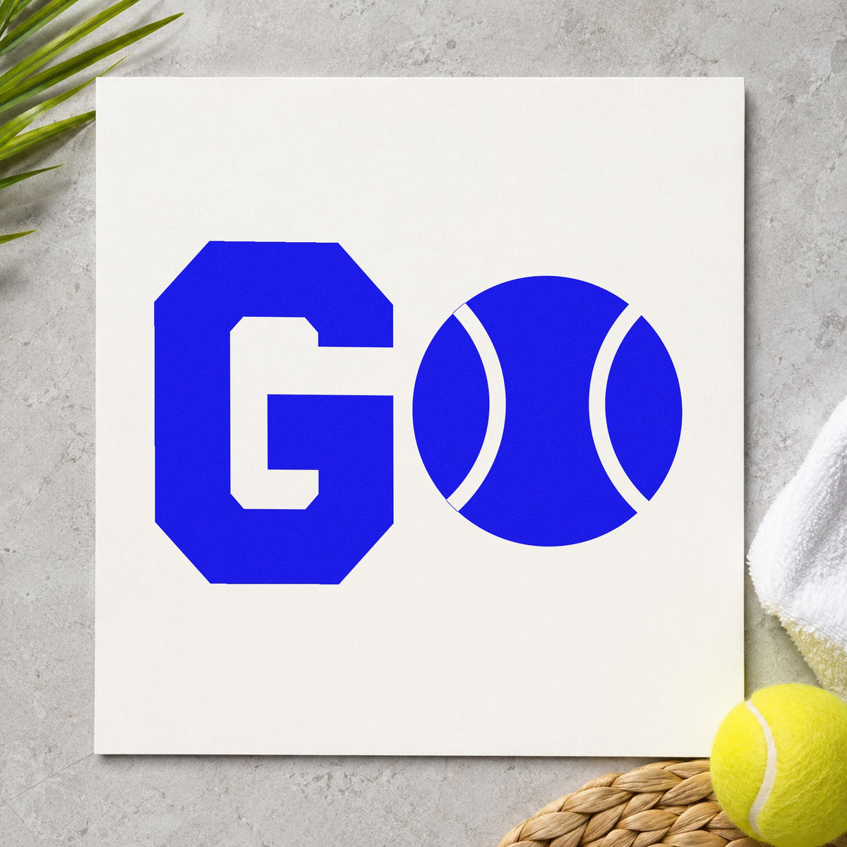 Go Tennis Ball Letter craft stamp imprinted in blue ink on paper, a design suited to framed court gate.