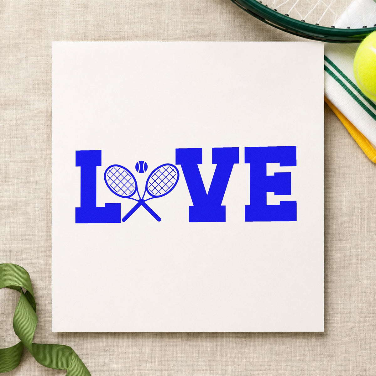 Love Crossed Tennis Rackets craft stamp in blue ink on cardstock, an easy option for court towel printing.