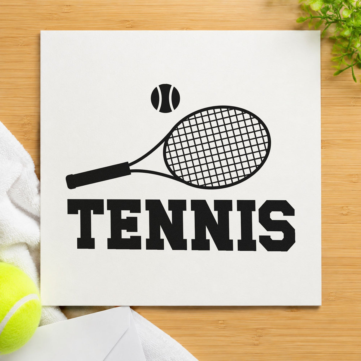 Tennis Racket And Ball craft stamp imprint in black ink on a handmade project, one idea being strung racket tags.