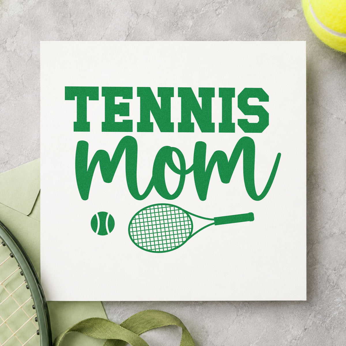 Tennis Mom Racket Ball craft stamp in green ink on cardstock, an easy option for event table album page.