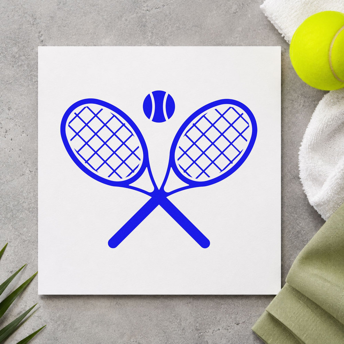 Crossed Tennis Rackets Ball craft stamp imprinted in blue ink on paper, a design suited to framed club foyer.