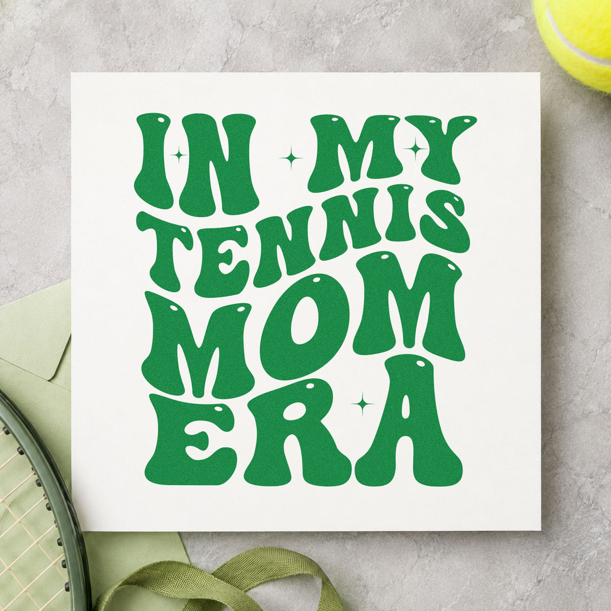 Tennis Mom Era Lettering craft stamp in green ink on cardstock, an easy option for parent group album page.
