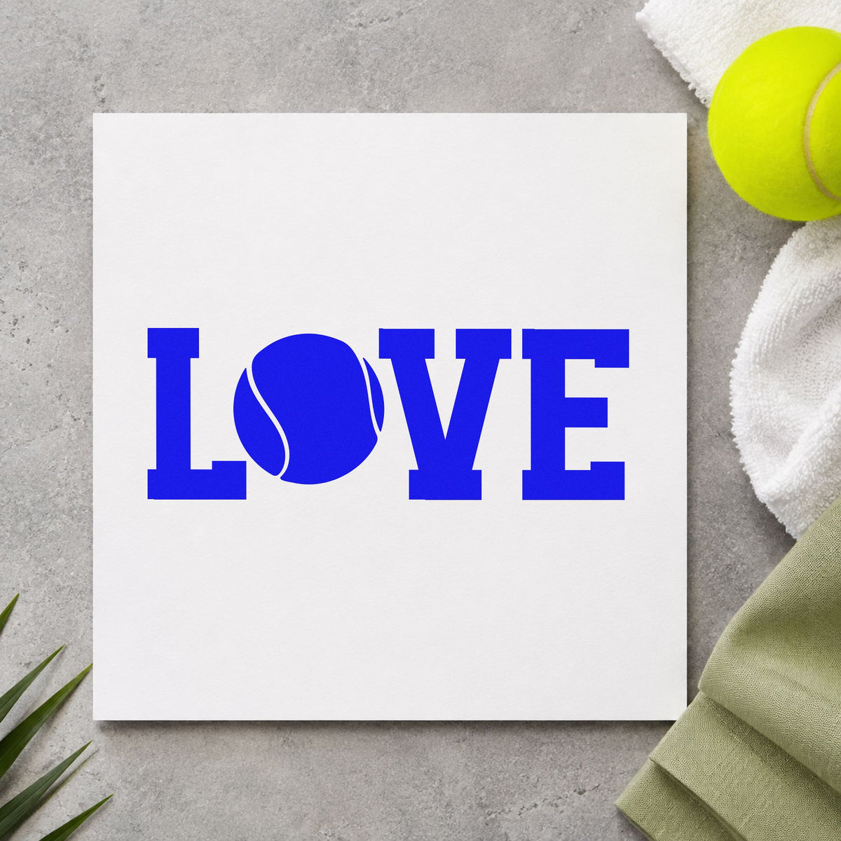 Love Tennis Ball Letter craft stamp imprinted in blue ink on paper, a design suited to framed welcome easel.