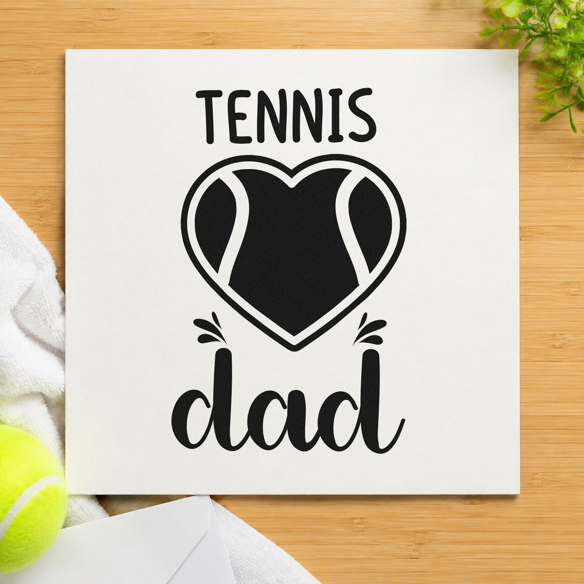 Tennis Dad Heart Ball craft stamp imprint in black ink on a handmade project, one idea being end season gift tags.