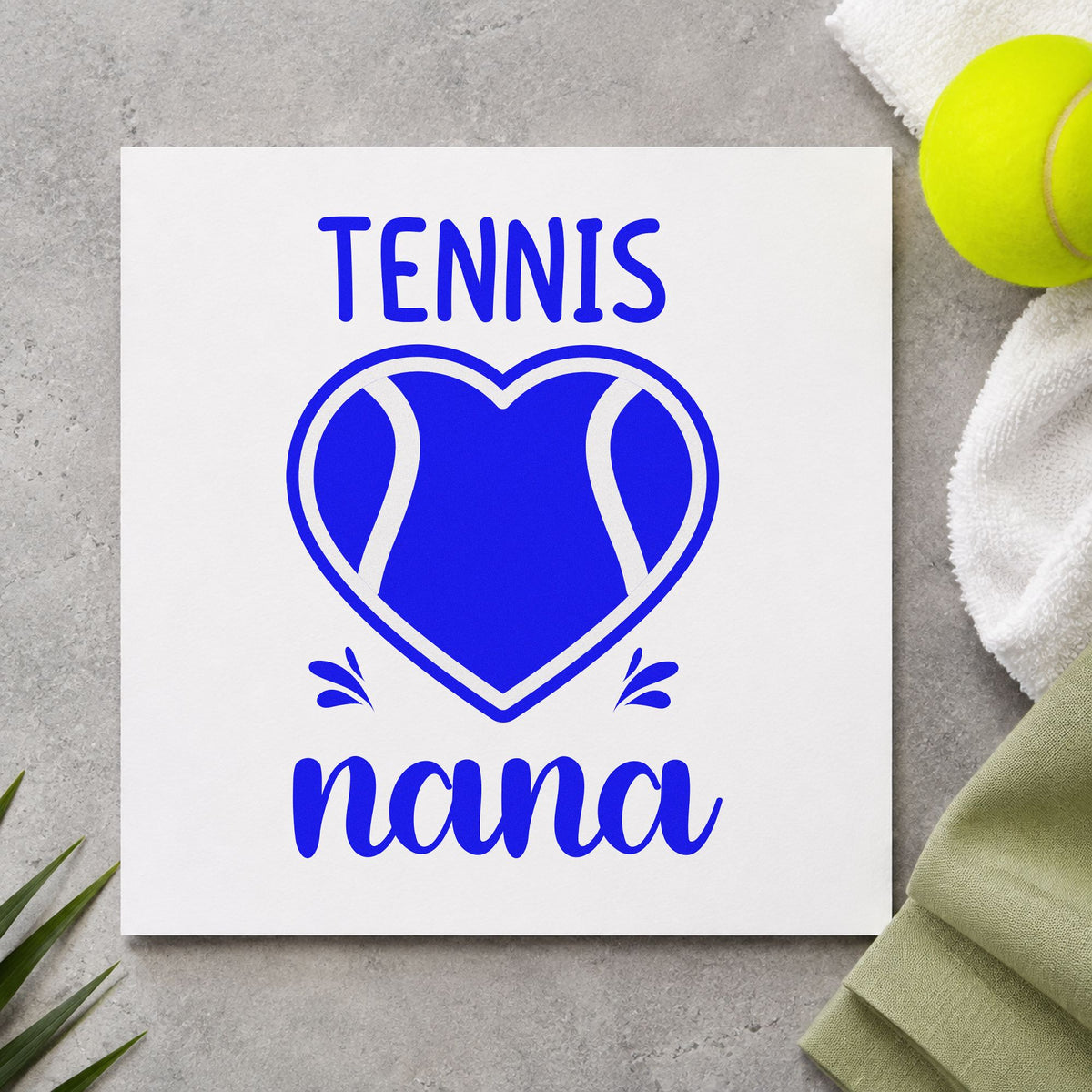 Tennis Nana Heart Ball craft stamp imprinted in blue ink on paper, a design suited to framed kitchen nook.