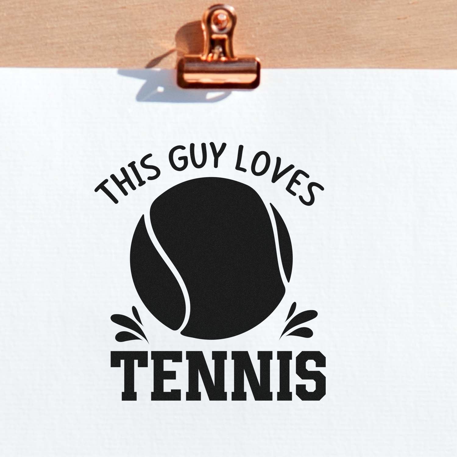 Custom tennis rubber stamp design reading This Guy Loves Tennis with tennis ball graphic, perfect for sports-themed gifts.