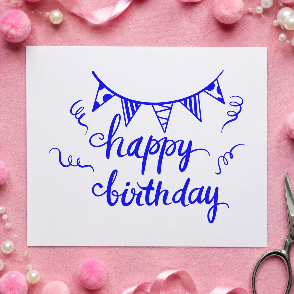 Birthday Bunting Streamer Script craft stamp imprinted in blue ink on paper, a design suited to framed garden gate.