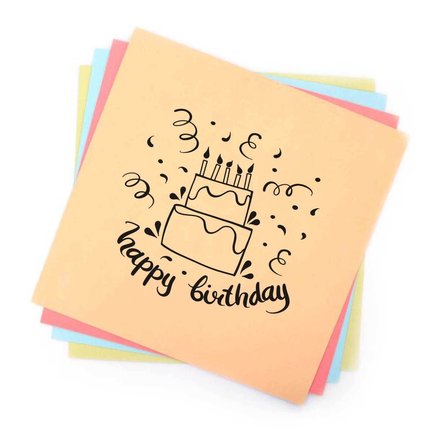 Happy birthday cake rubber stamp design on pastel paper, perfect for birthday cards, scrapbooking, and party crafts.