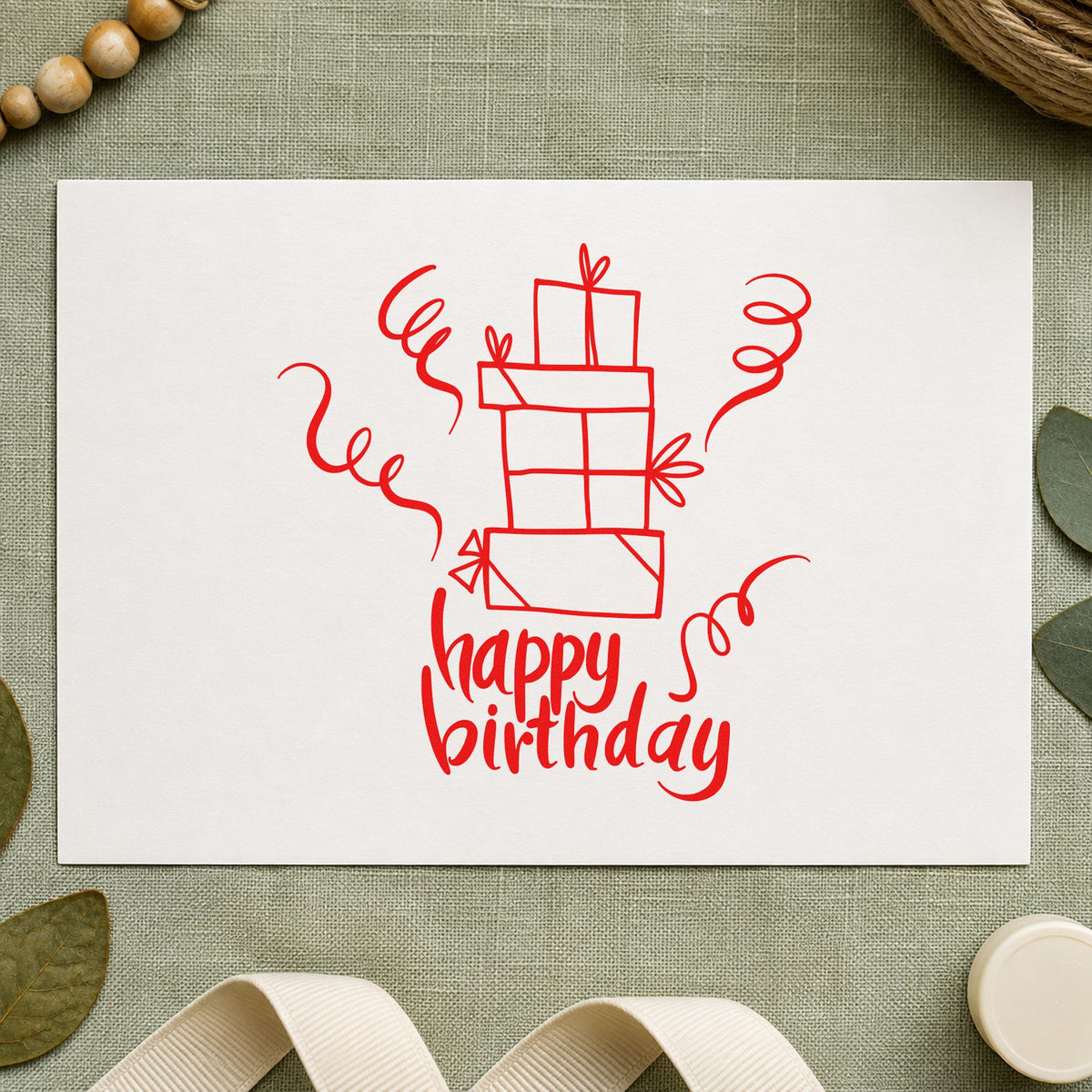Birthday Stacked Gift Boxes craft stamp imprint in red ink on a handmade project, one idea being claim slip cards.