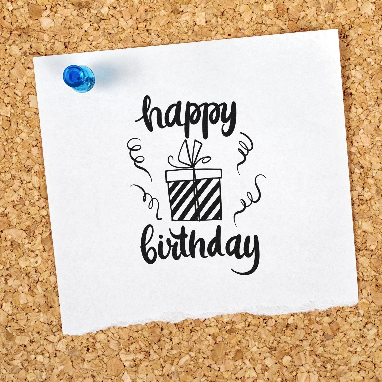 Happy birthday rubber stamp design with gift box and confetti on pinned paper, ideal for birthday card crafting.