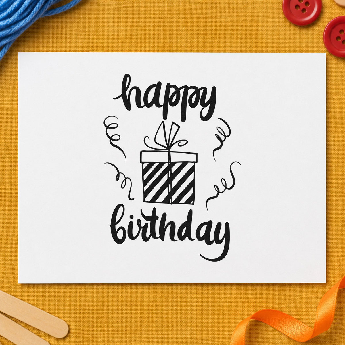 Birthday Striped Gift Box craft stamp imprint in black ink on a handmade project, one idea being outgoing gift tags.