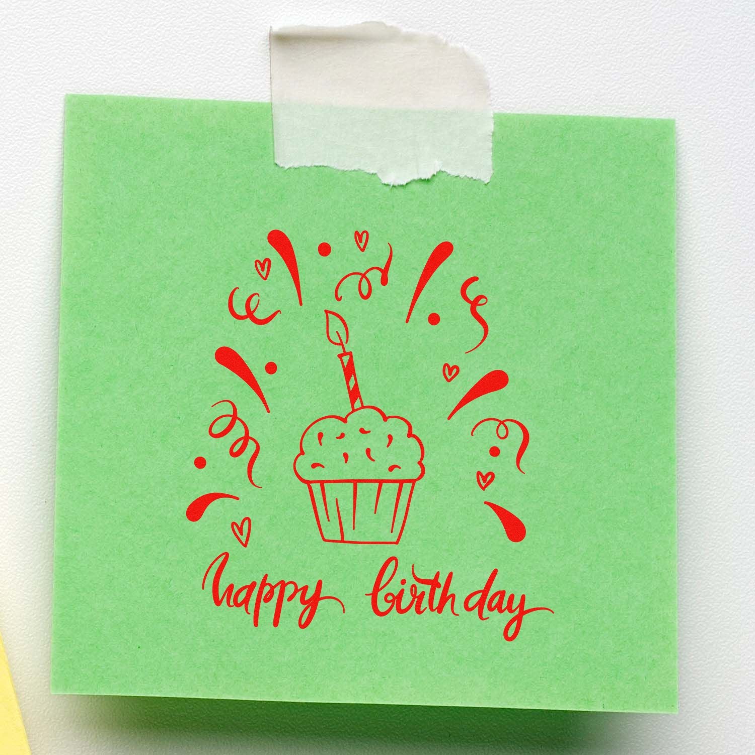 Happy birthday cupcake rubber stamp design on green paper, ideal for custom birthday cards and party stationery.