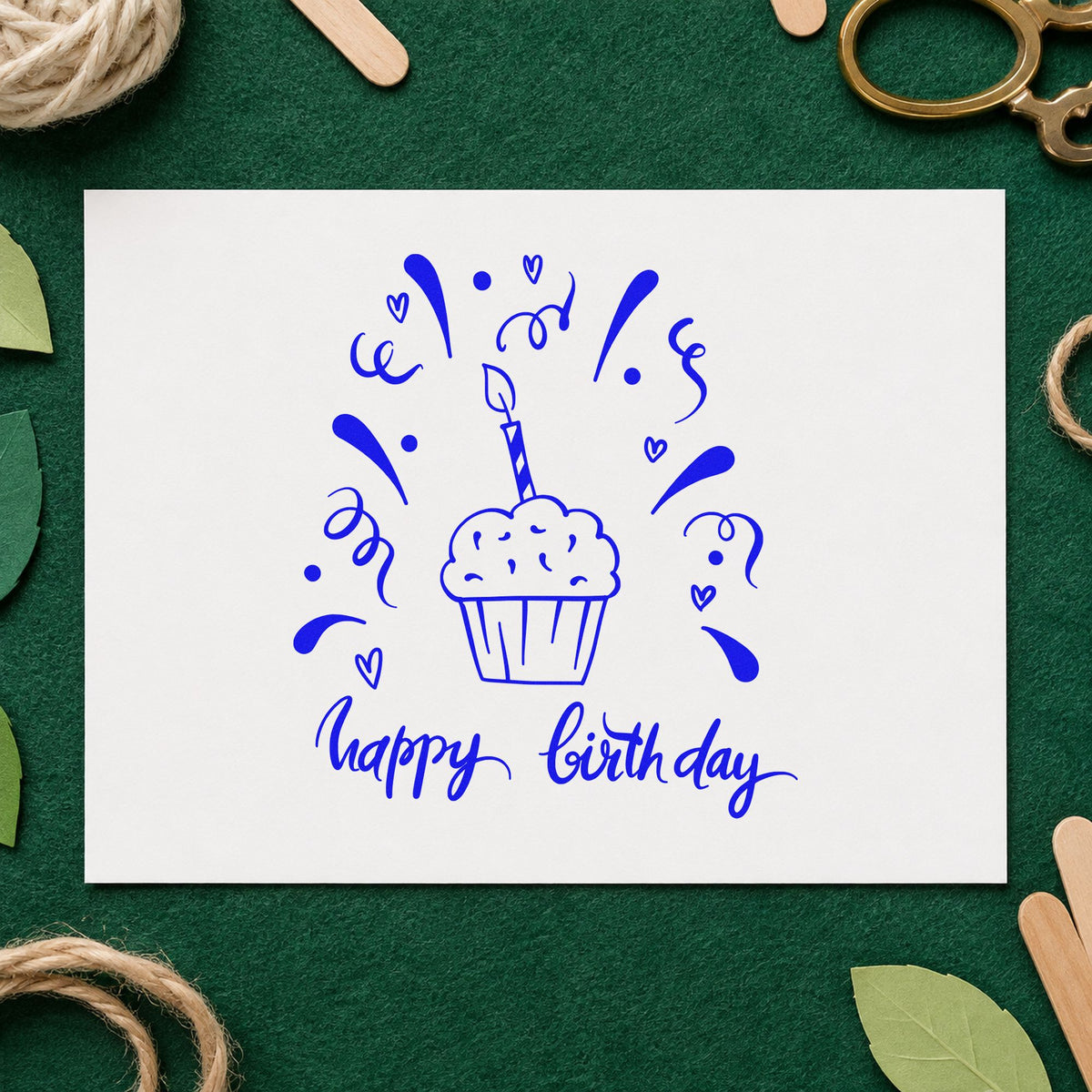 Birthday Cupcake Candle Confetti craft stamp imprinted in blue ink on paper, a design suited to framed classroom door.
