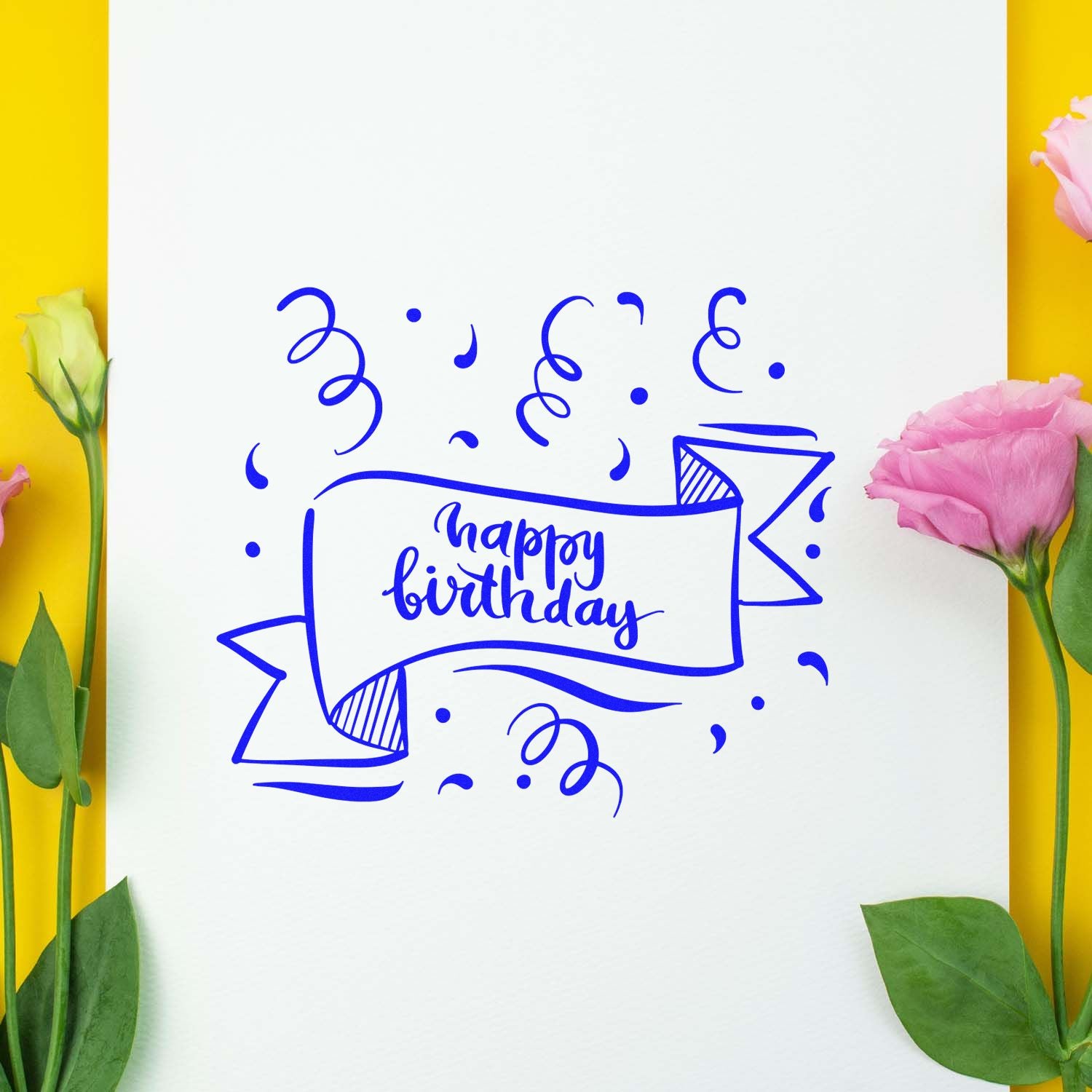 Happy birthday rubber stamp design in blue ink with ribbon banner and confetti, styled with flowers on white paper.