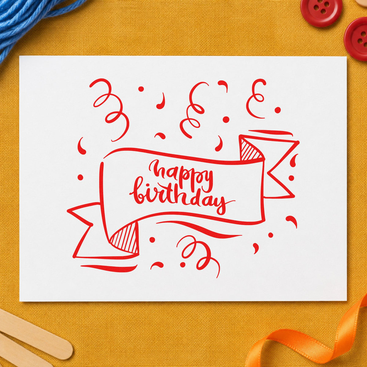 Happy Birthday Ribbon Banner rubber stamp shown in red ink, stamped for projects such as drawer design labels.