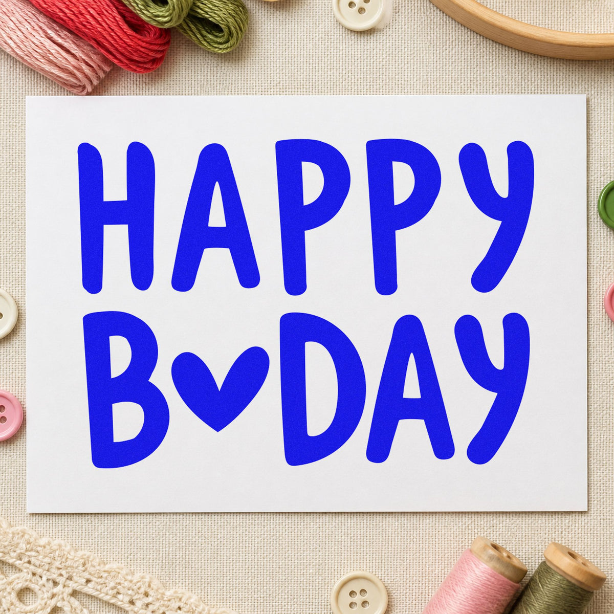 Happy Birthday Heart Letter craft stamp imprinted in blue ink on paper, a design suited to framed bedroom shelf.