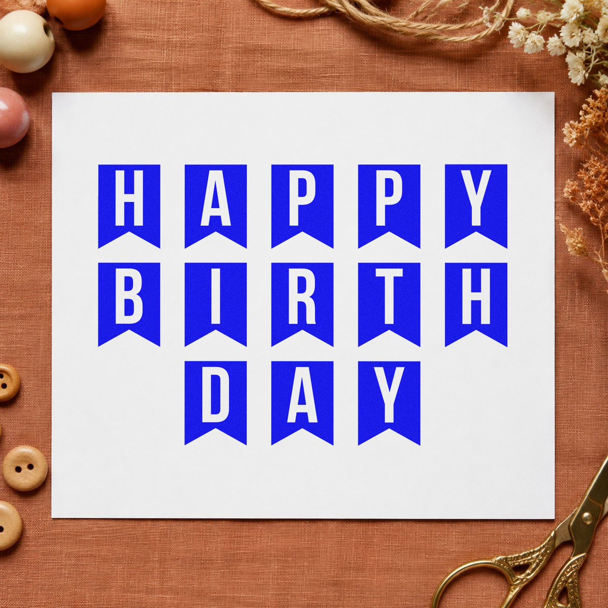 Happy Birthday Pennant Letters craft stamp imprinted in blue ink on paper, a design suited to framed store room.