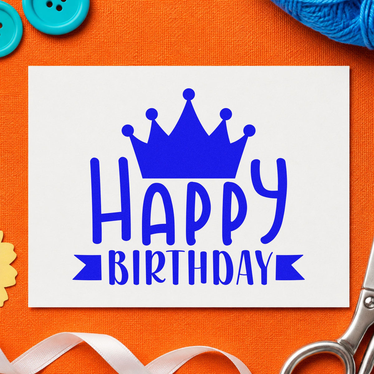 Happy Birthday Crown Banner craft stamp imprinted in blue ink on paper, a design suited to framed hall entry.