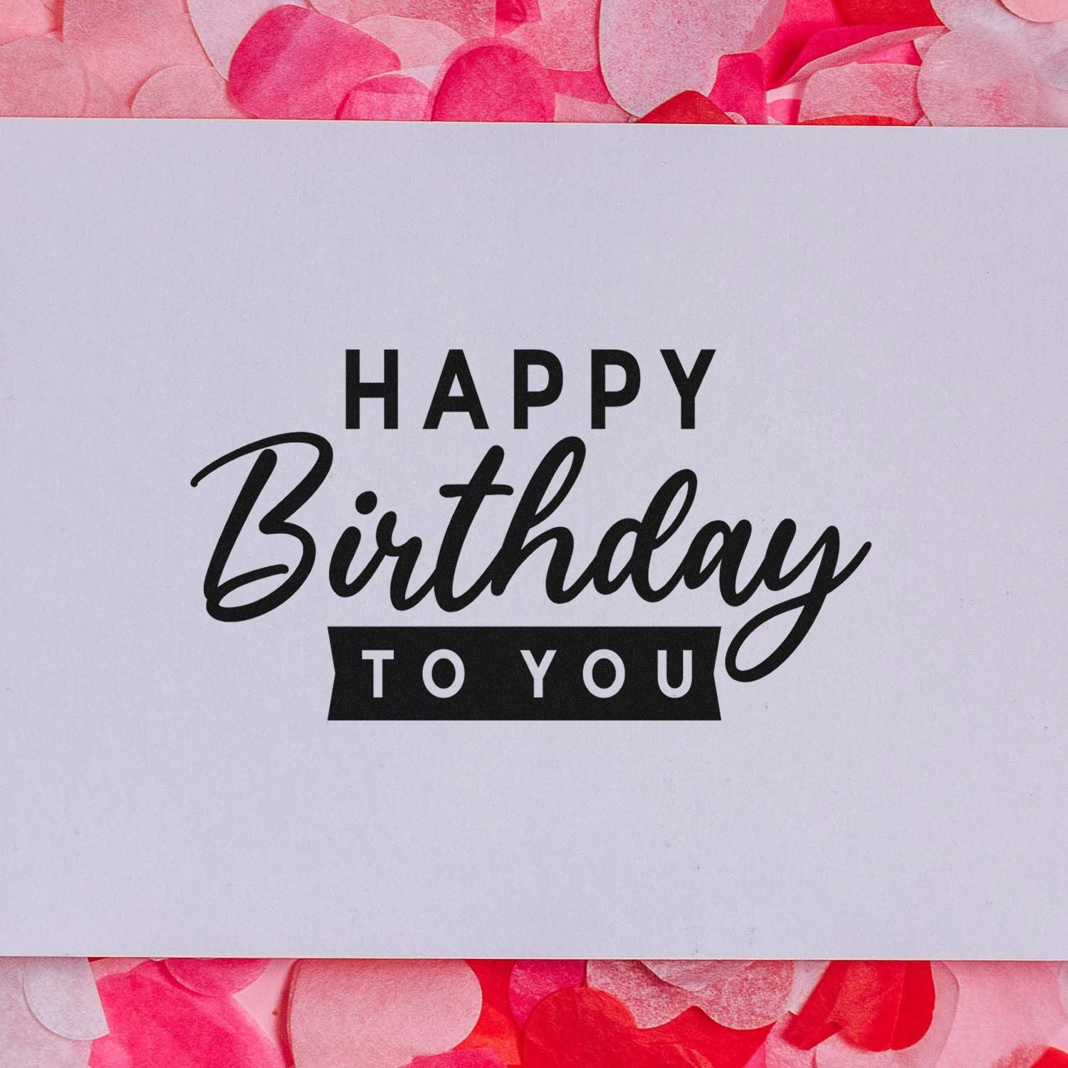 Happy Birthday to You rubber stamp design on white paper with pink confetti background for birthday cards and crafts.