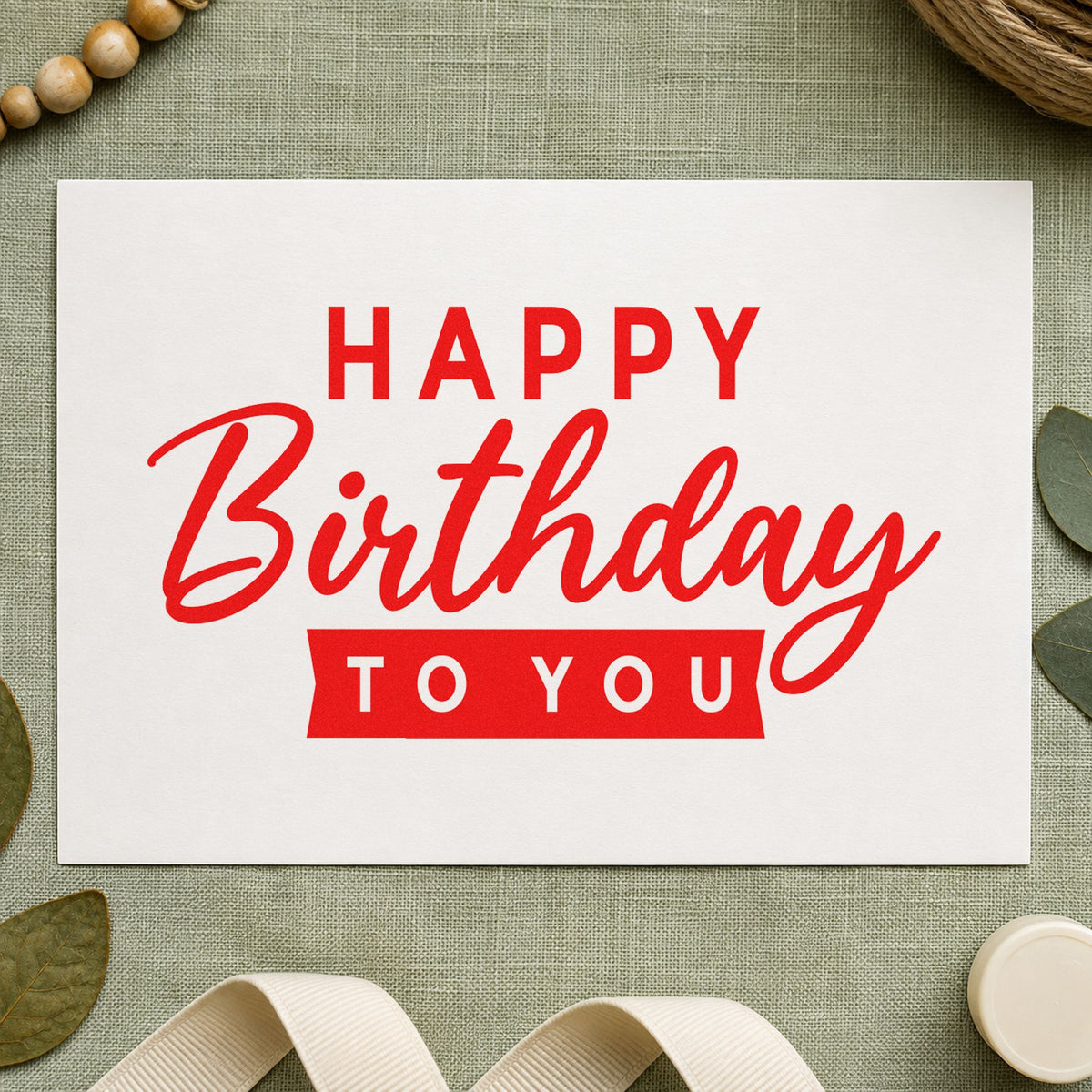 Happy Birthday To You craft stamp imprint in red ink on a handmade project, one idea being neighbor note cards.