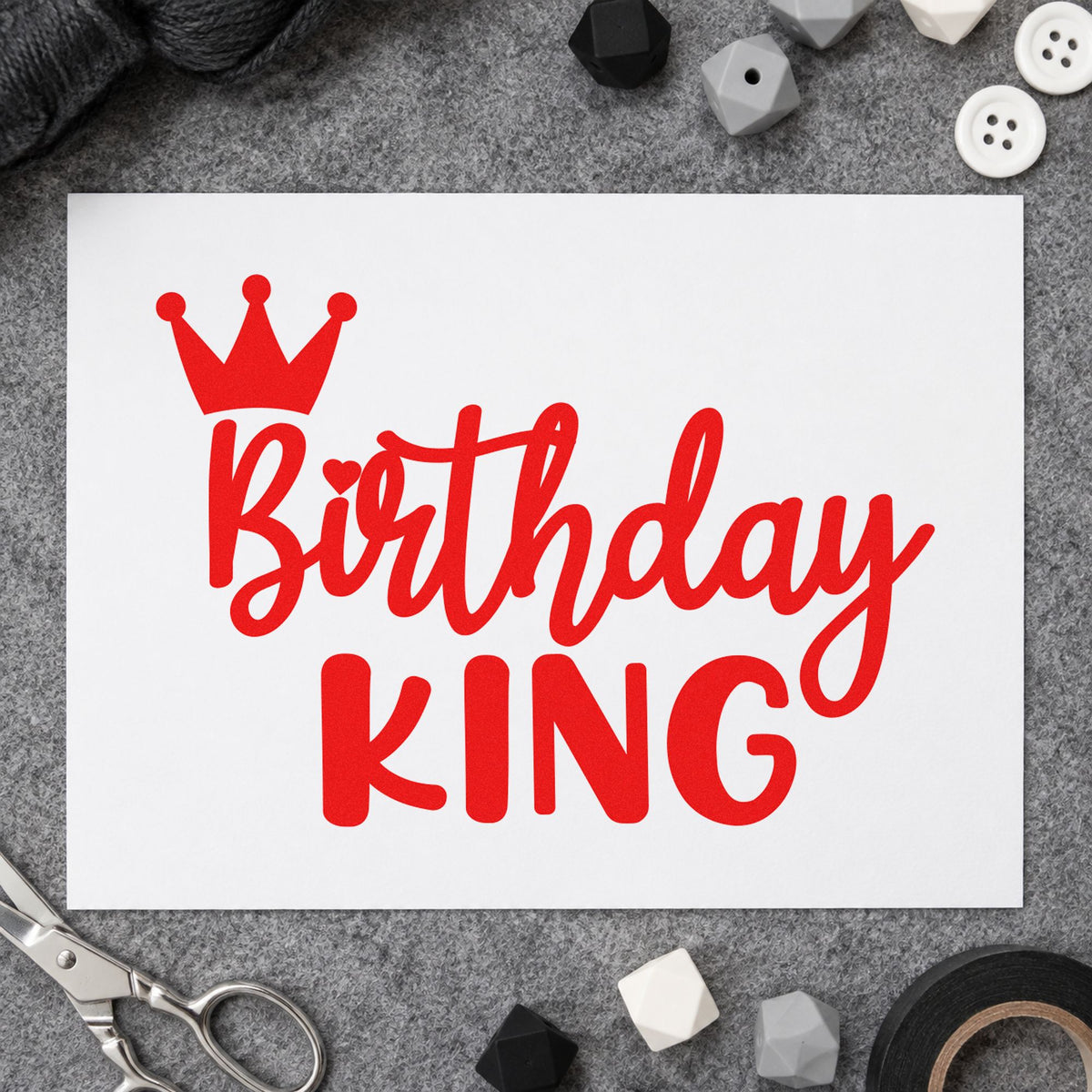 Birthday King Tilted Crown rubber stamp shown in red ink, stamped for projects such as bin decor labels.