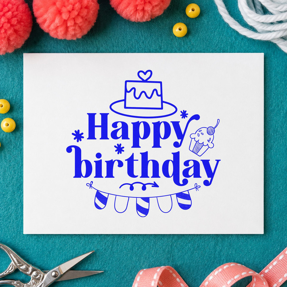 Happy Birthday Cake Bunting craft stamp in blue ink on cardstock, an easy option for pillowcase printing.