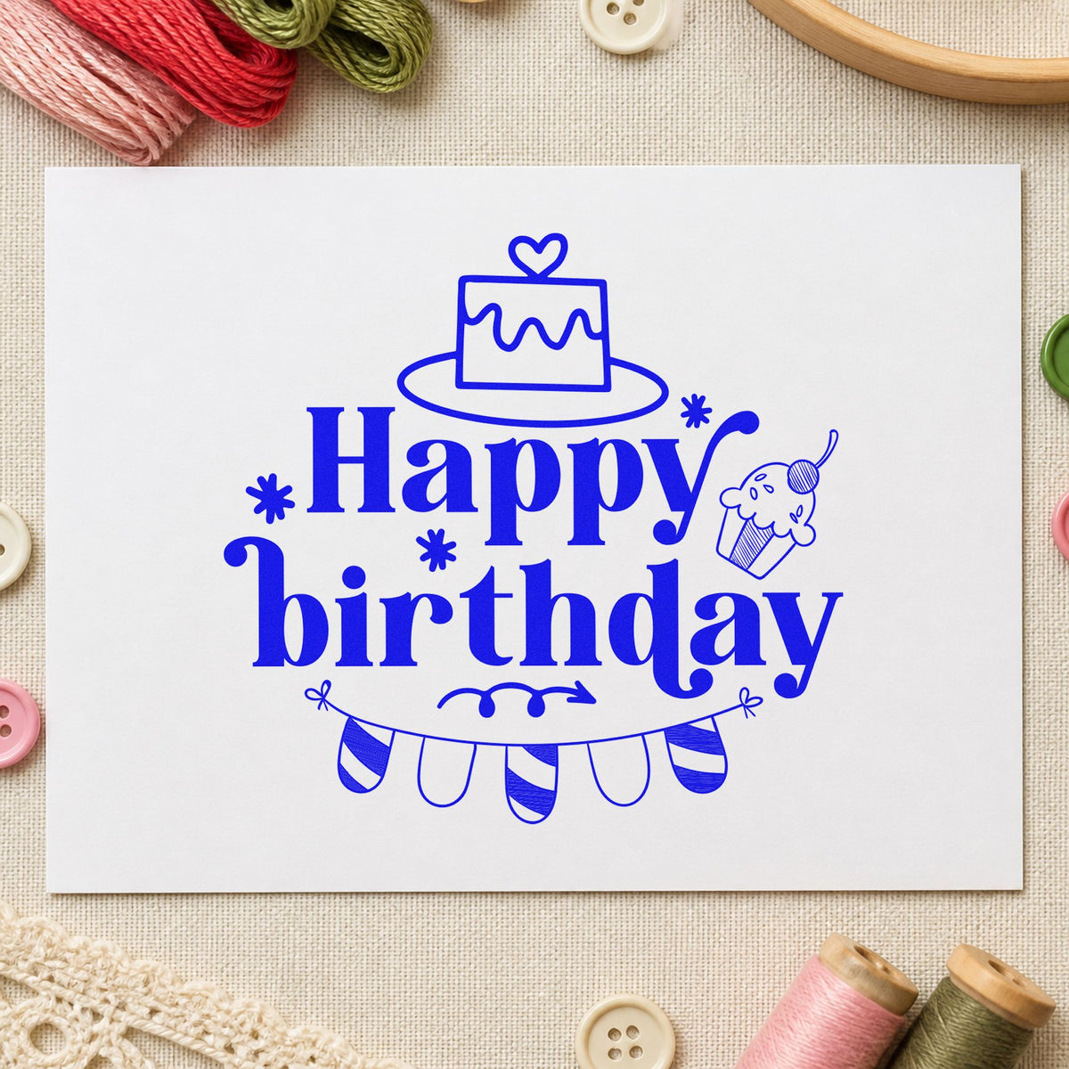 Happy Birthday Cake Bunting craft stamp imprinted in blue ink on paper, a design suited to framed bedroom wall.