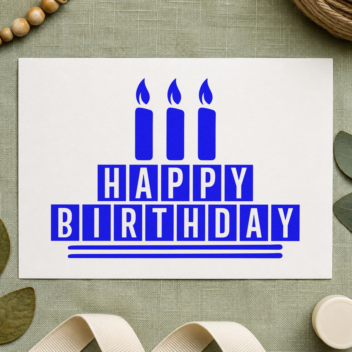 Birthday Block Candle Cake craft stamp imprinted in blue ink on paper, a design suited to framed club room.