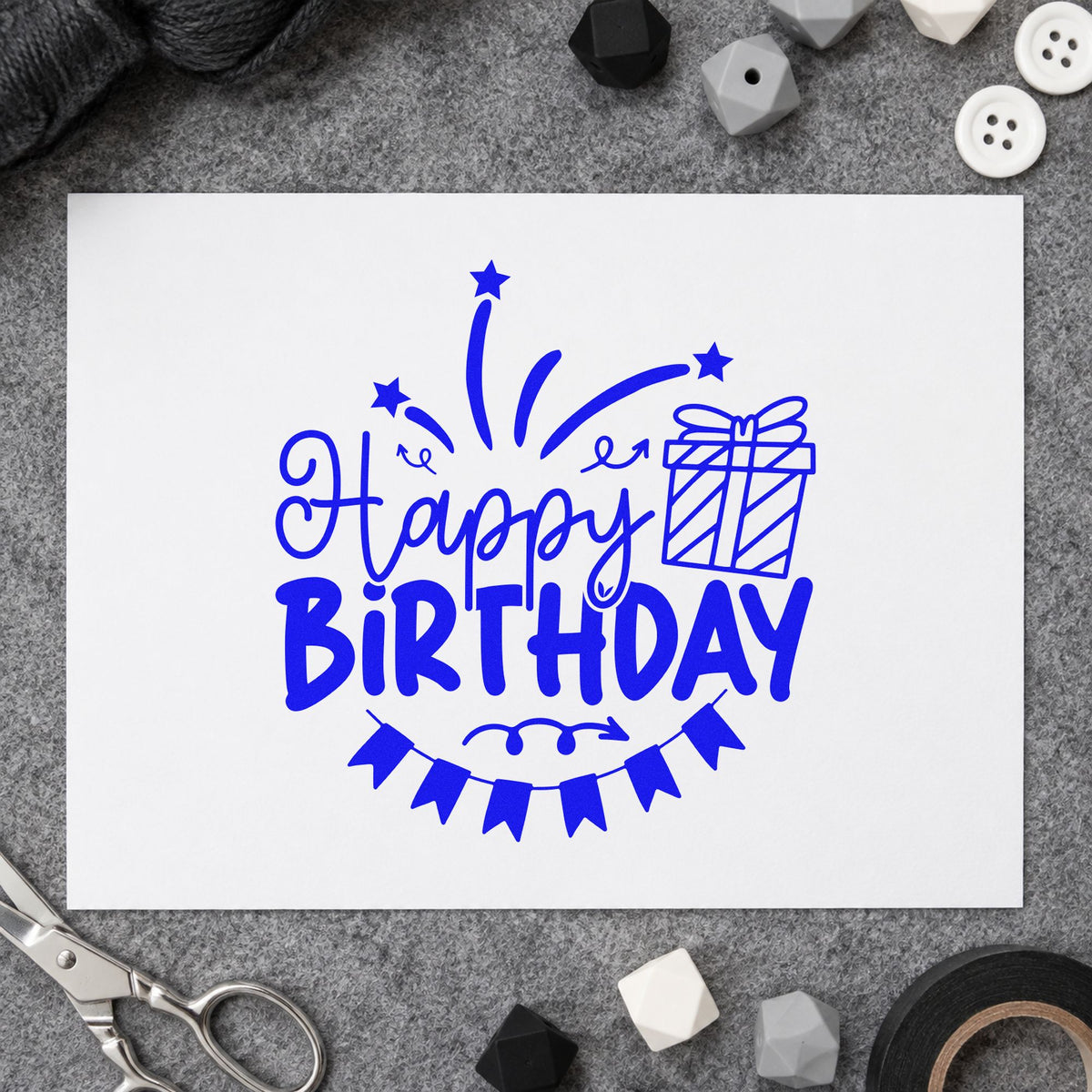 Happy Birthday Gift Bunting craft stamp in blue ink on cardstock, an easy option for counter cloth printing.
