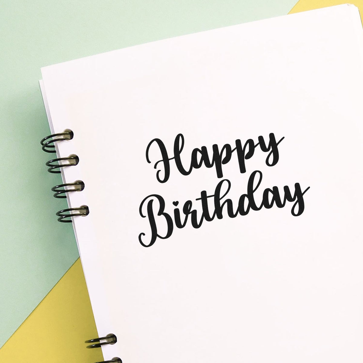 Happy Birthday Bold Script Premium Wooden Stamp - Vintage Pro imprint stamped in black ink. Happy Birthday appears in two lines of thick flowing script.