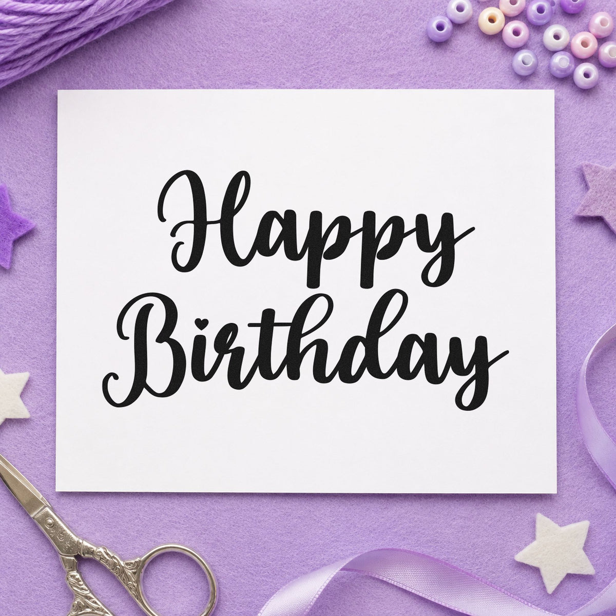 Happy Birthday Bold Script craft stamp imprint in black ink on a handmade project, one idea being design pack tags.