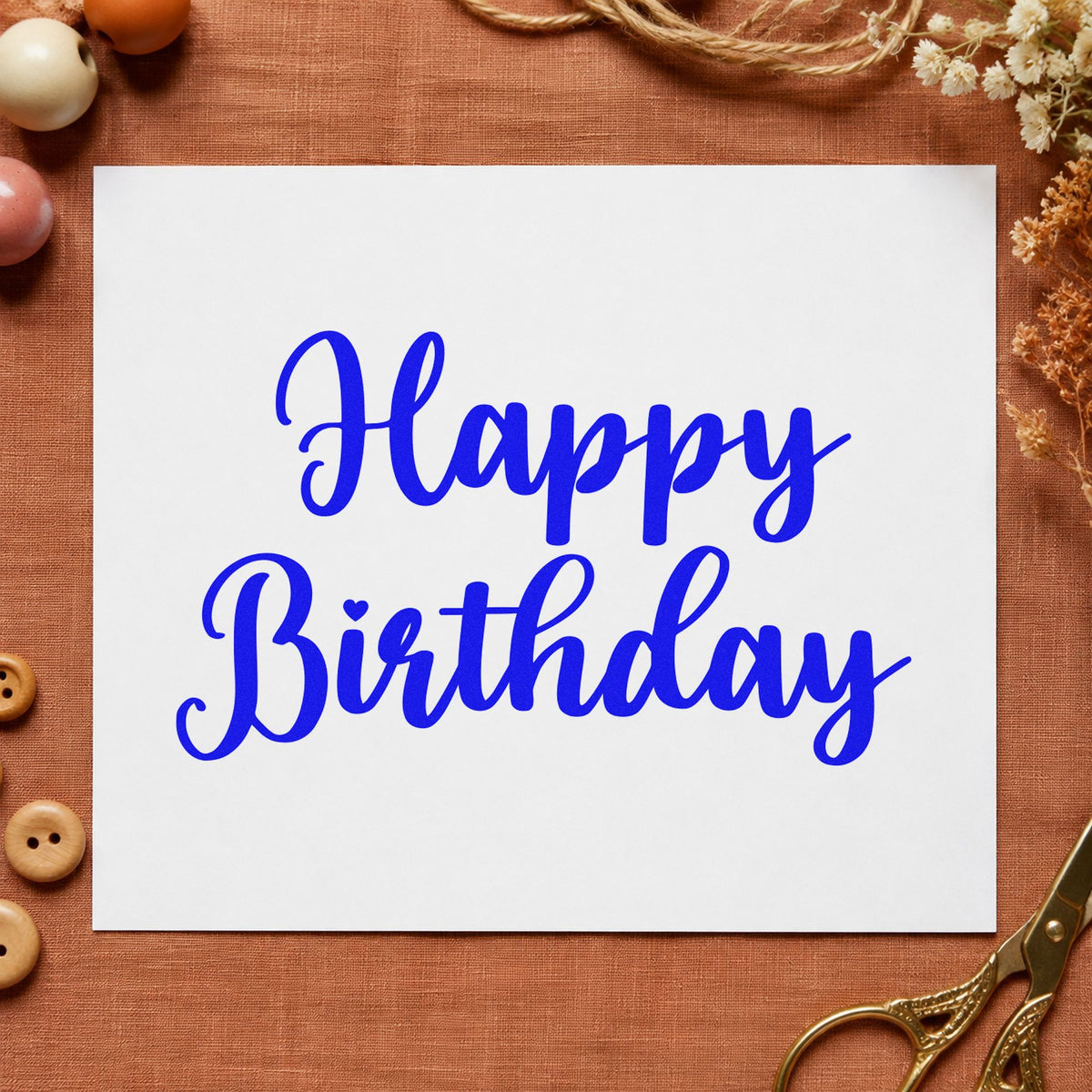 Happy Birthday Bold Script craft stamp imprinted in blue ink on paper, a design suited to framed making desk.