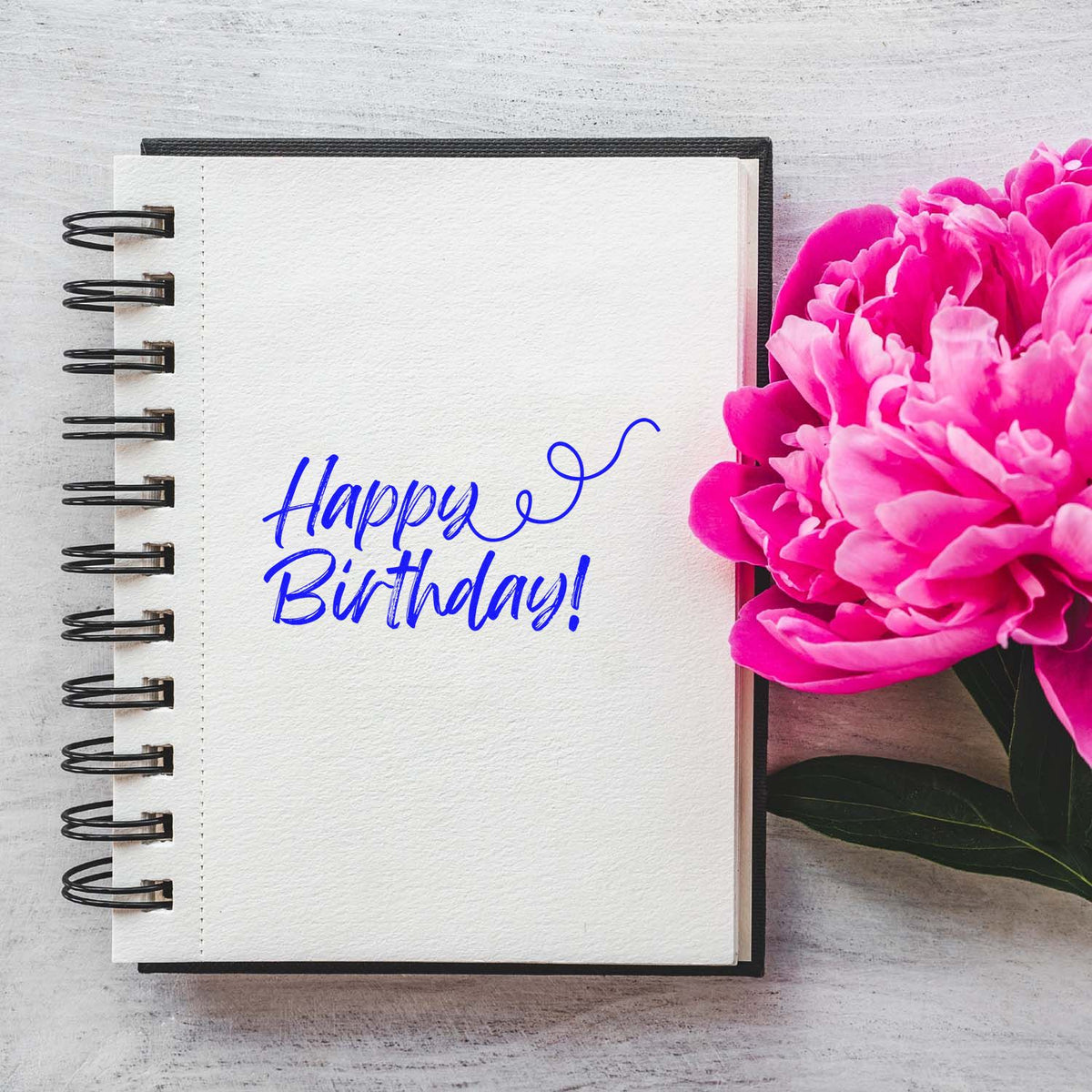 Happy Birthday Curl Flourish rubber stamp shown in purple ink, stamped for projects such as journal year album page.