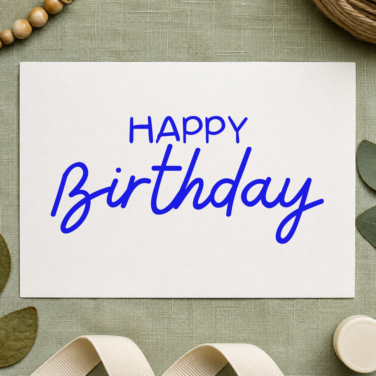 Happy Birthday Casual Script craft stamp imprinted in blue ink on paper, a design suited to framed chalk board.