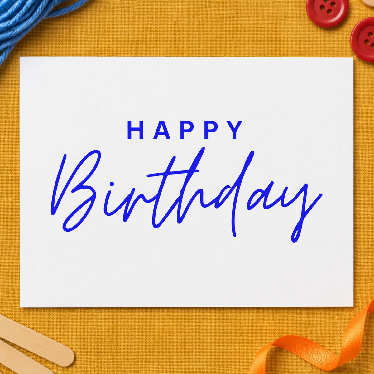 Happy Birthday Spaced Capitals craft stamp in blue ink on cardstock, an easy option for mail pouch printing.