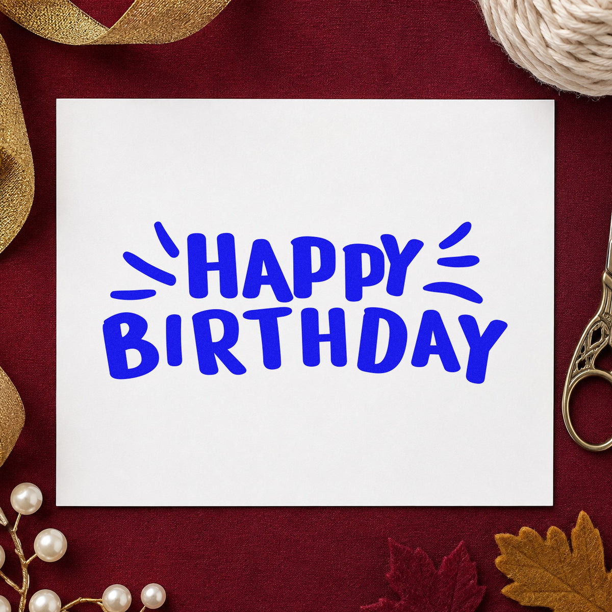 Happy Birthday Radiating Strokes craft stamp in blue ink on cardstock, an easy option for host tee printing.