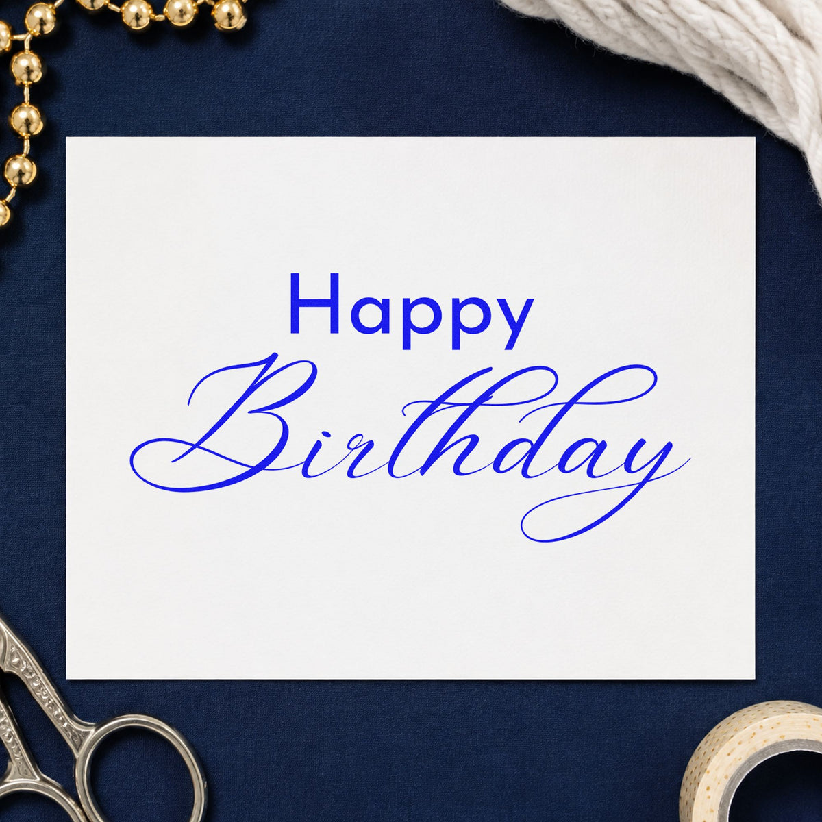 Happy Birthday Fine Calligraphy craft stamp imprinted in blue ink on paper, a design suited to framed work bench.