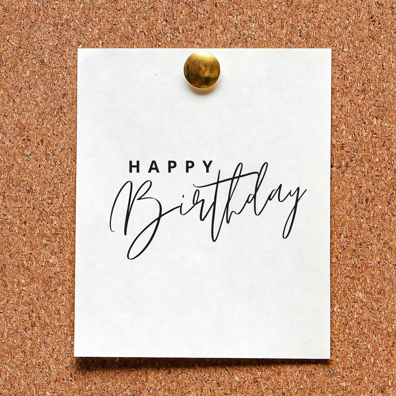 Happy Birthday rubber stamp design on pinned white card, ideal for handmade birthday cards and scrapbooking.