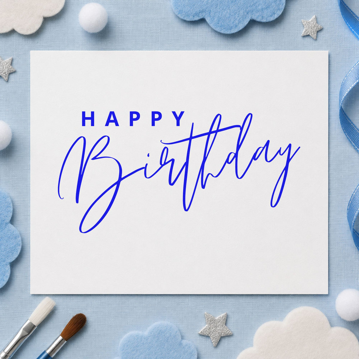Happy Birthday Sweeping Script craft stamp in blue ink on cardstock, an easy option for build cloth printing.