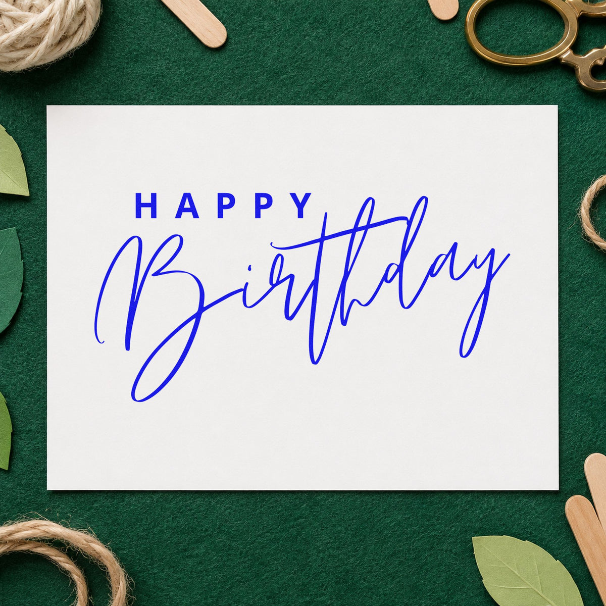 Happy Birthday Sweeping Script craft stamp imprinted in blue ink on paper, a design suited to framed prep kitchen.