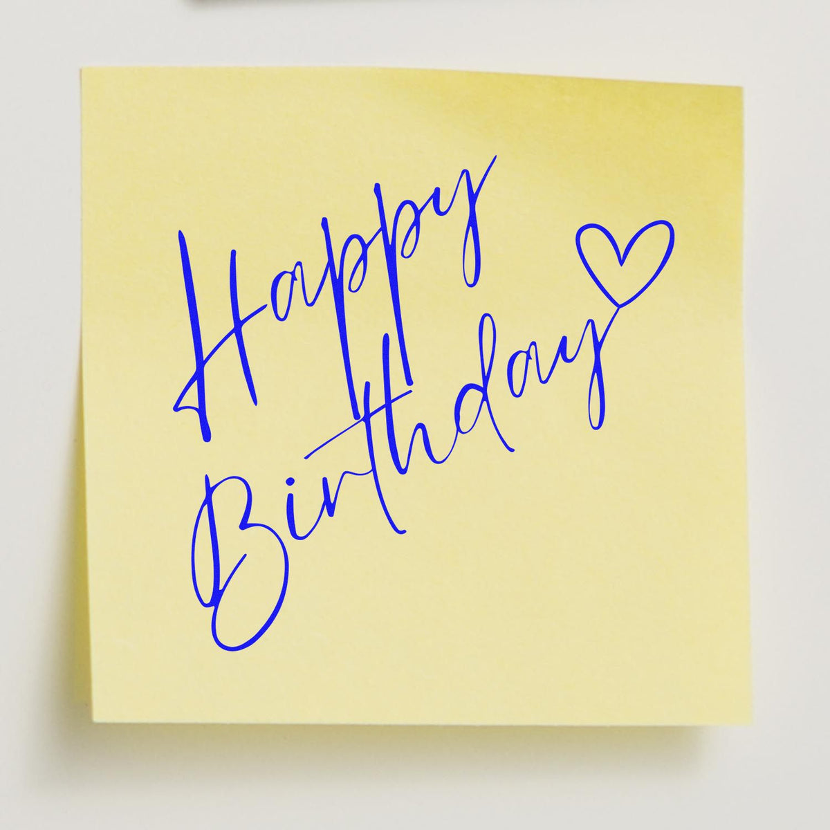 Diagonal Birthday Heart Script rubber stamp shown in blue ink, stamped for projects such as quiet year album page.
