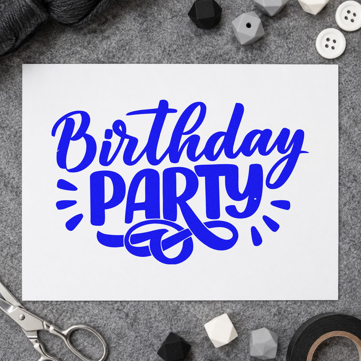Birthday Party Bold Flourish craft stamp in blue ink on cardstock, an easy option for bandana panel printing.