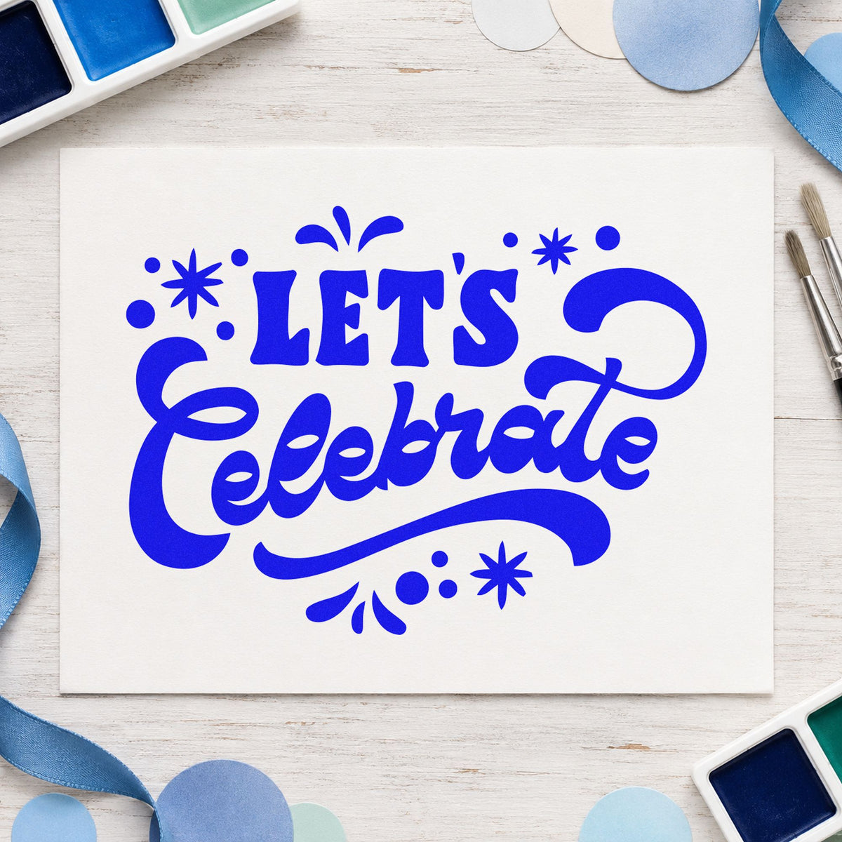 Let's Celebrate Script craft stamp in blue ink on cardstock, an easy option for hall bunting printing.