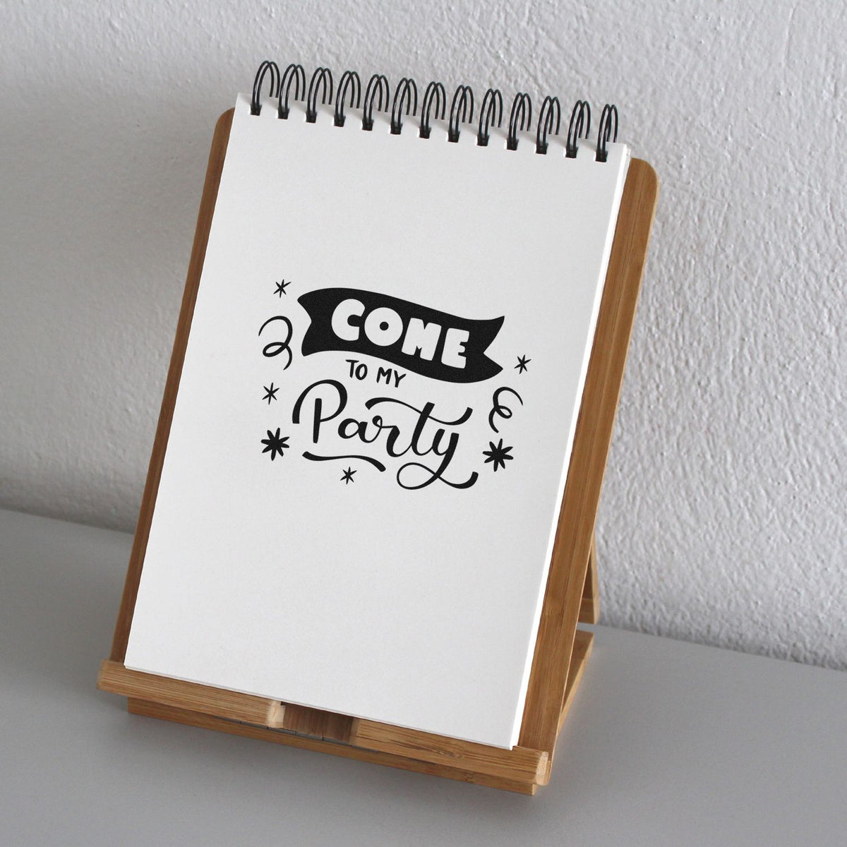 Come To My Party Premium Wood-Mounted Stamp - Vintage Pro imprint stamped in black ink. COME appears on a dark ribbon above TO MY Party with streamers and stars.