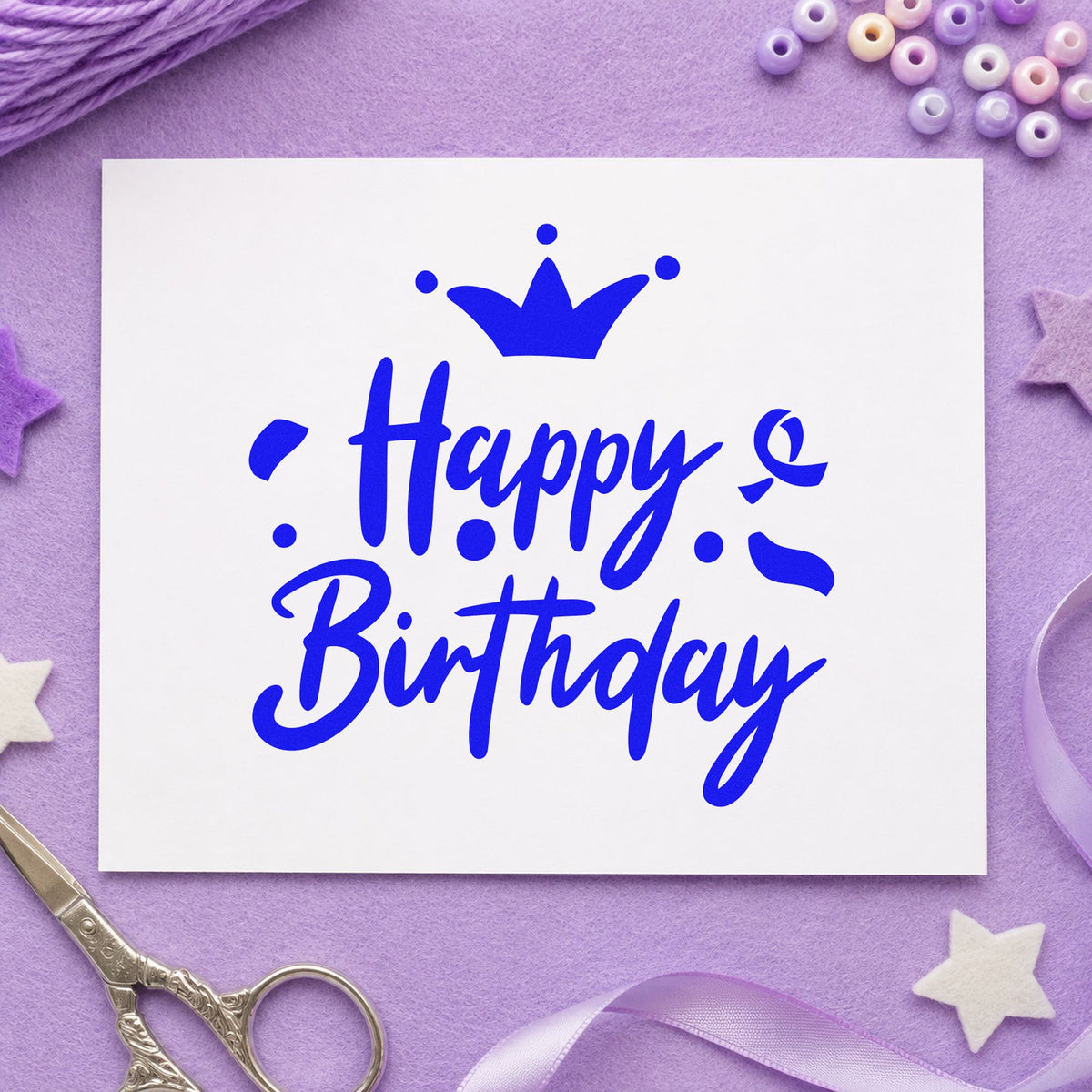 Birthday Crown Confetti Script craft stamp in blue ink on cardstock, an easy option for cape hem printing.