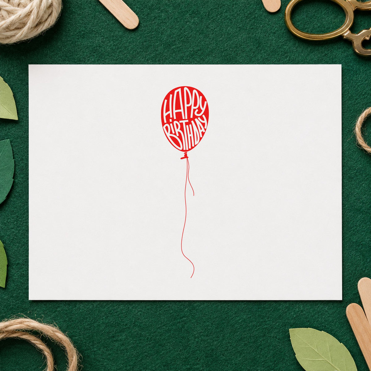 Happy Birthday Single Balloon craft stamp imprint in red ink on a handmade project, one idea being gallery hunt cards.
