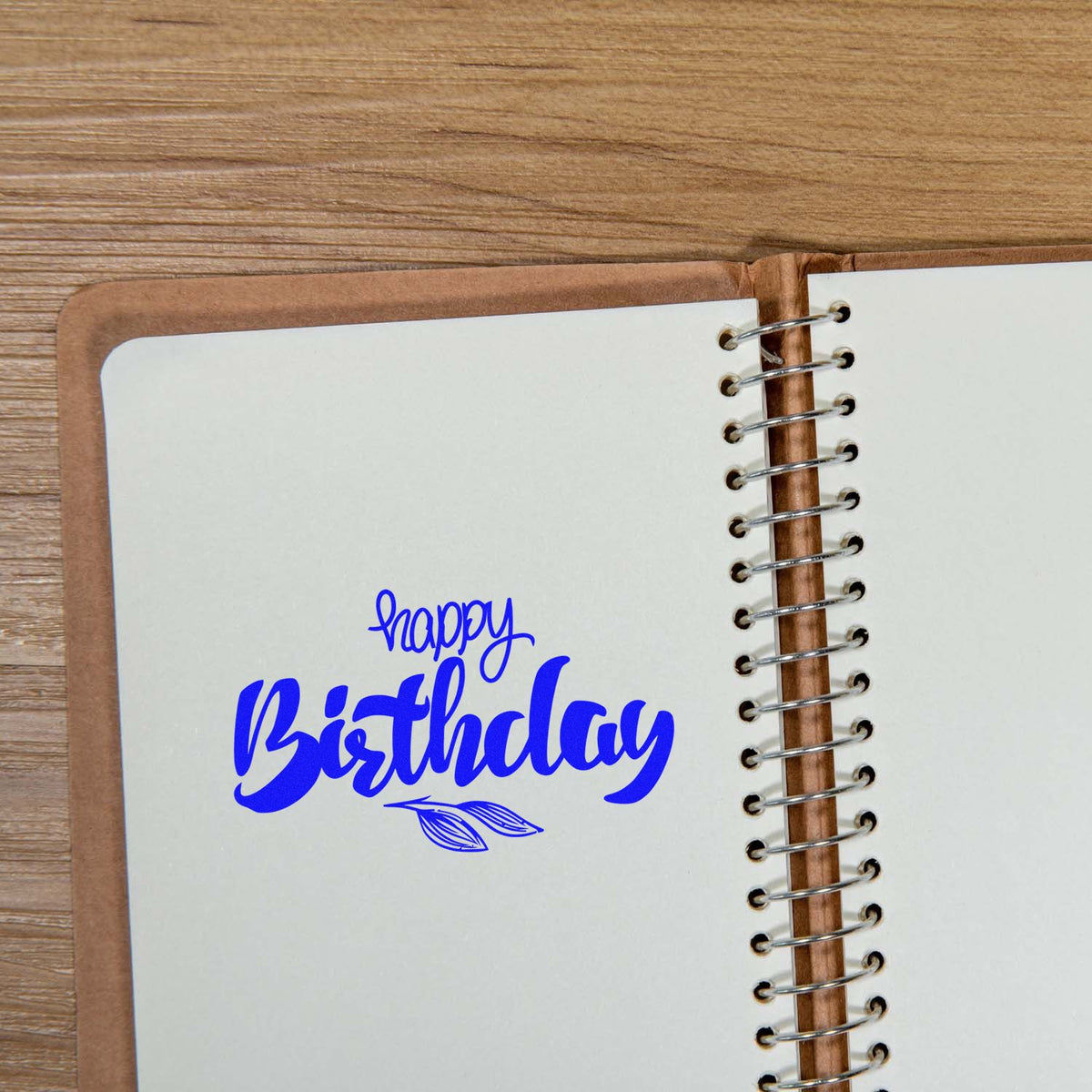 Birthday Script Leaf Sprig rubber stamp shown in blue ink, stamped for projects such as potted year album page.