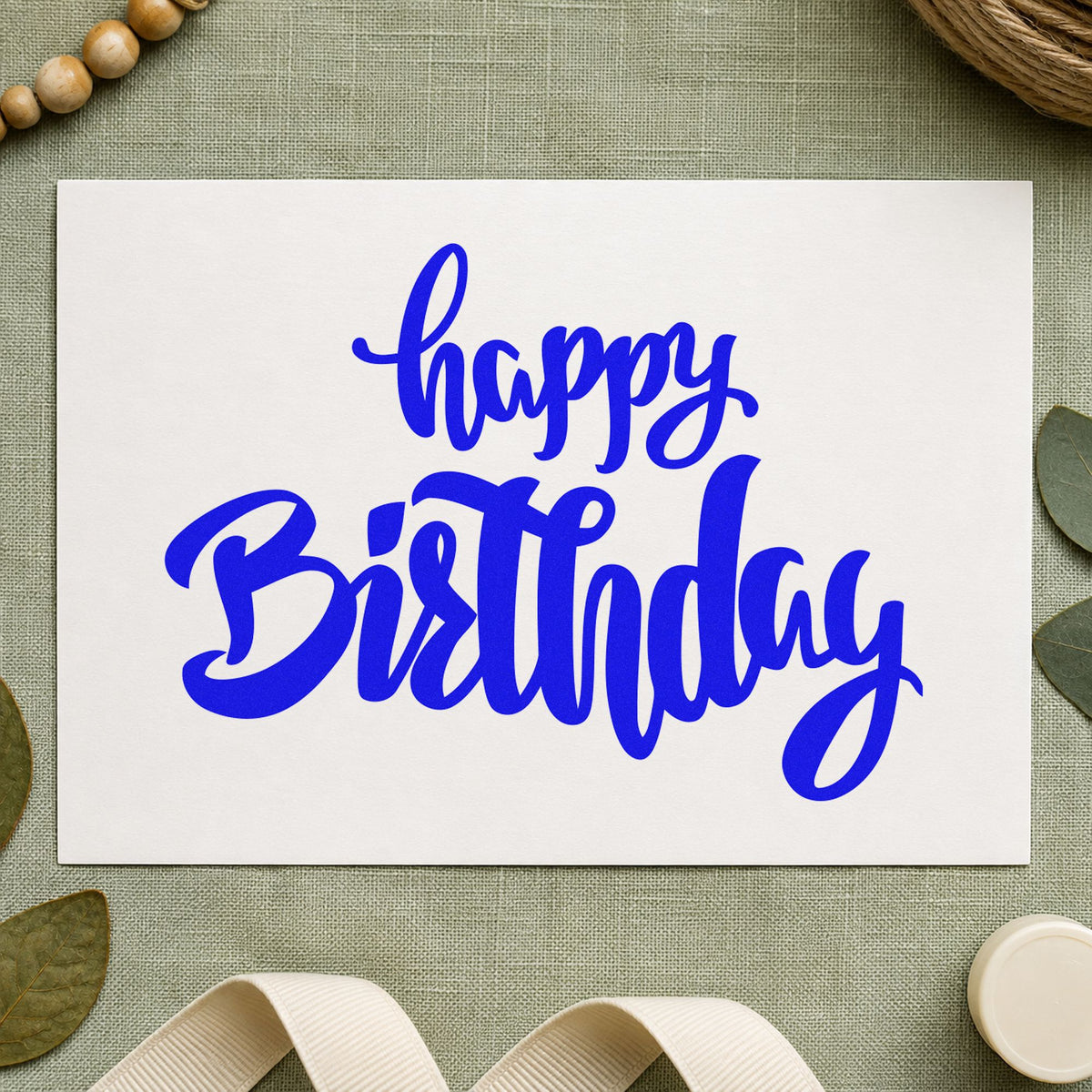 Happy Birthday Heavy Script craft stamp imprinted in blue ink on paper, a design suited to framed back bar.
