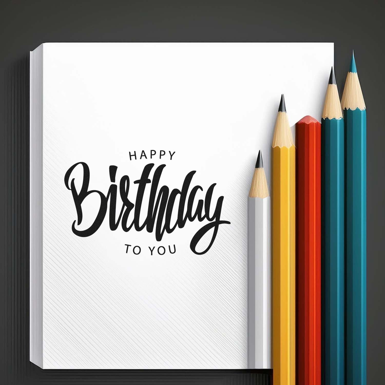 Happy Birthday to You rubber stamp design on notebook page with colorful pencils for custom birthday cards.