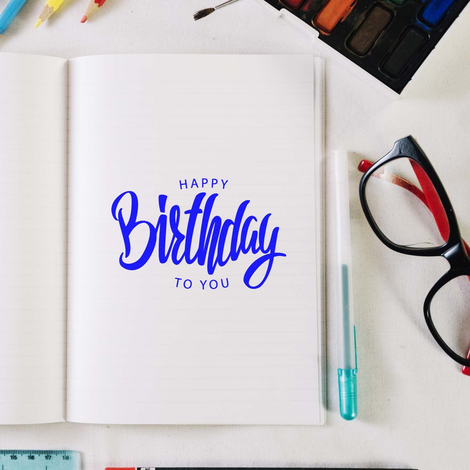 Happy Birthday to You rubber stamp design in an open notebook, ideal for birthday card making and scrapbooking.